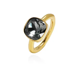 Detailed view of square cut grey crystal set in a minimalist gold band ring