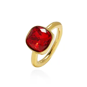 Elegant gold ring featuring a large square-cut red gemstone with a polished mirror finish