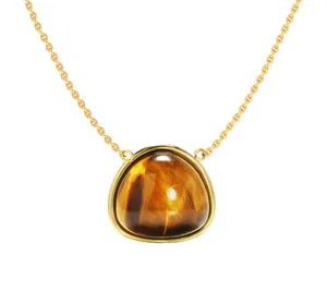 Detail of round triangle pendant with tiger's eye stone and gold plated chain