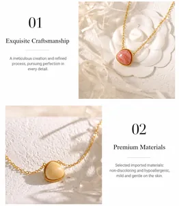 Detail of brass necklace featuring geometric pink stone pendant with a polished gold finish