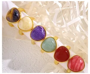 Detailed set of six gold titanium steel rings with assorted natural tiger eye and agate stones