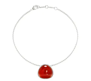 Detail view of silver stainless steel chain with a triangular red agate stone pendant