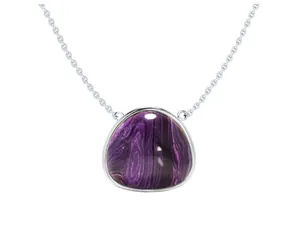 Macro shot of the triangular purple gemstone pendant with silver-plated chain detailing