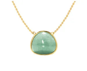 Detail of a vintage geometric necklace featuring a green gemstone in a gold-plated setting