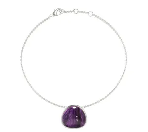 Close-up of a silver titanium steel bracelet with a marbled purple stone pendant charm