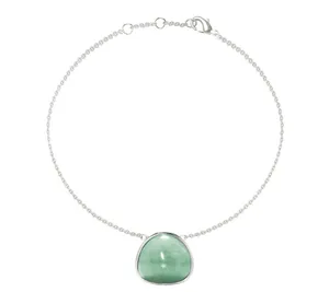 Detail of silver chain bracelet featuring light green gemstone and lobster clasp