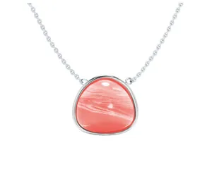 Detailed close-up of a silver necklace with a triangular coral pink natural stone pendant