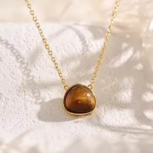 Vintage golden necklace featuring a geometric triangle Tiger Eye gemstone pendant