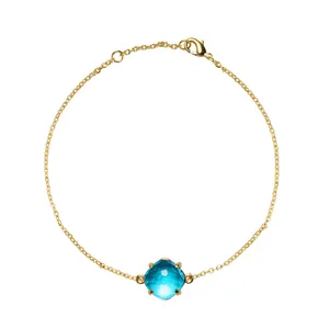Elegante gouden kettingarmband met gefacetteerd aquamarijn kristal in een vierpootszetting