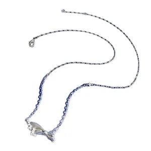 Brushed metal bow pendant necklace with sparkling pavé crystals on an O-chain link