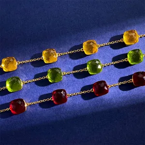 Japanese style gold chain bracelets with cushion-cut yellow, green, and red gemstones