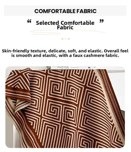 Detail of imitation cashmere scarf with brown and beige geometric maze pattern textures