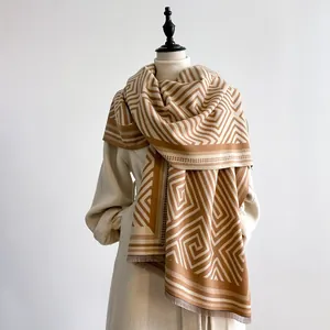 Elegant geometric pashmina scarf in camel and beige with tassels for autumn and winter