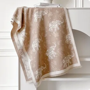 Thick elephant pattern cashmere-like scarf in caramel brown with tassels and paisley jacquard