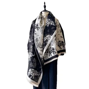 Thick cashmere-like scarf with black and white elephant paisley jacquard and fringes