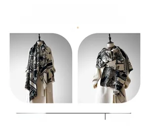 Detail of elegant Toile de Jouy cashmere feel scarf with vintage tree patterns and tassels