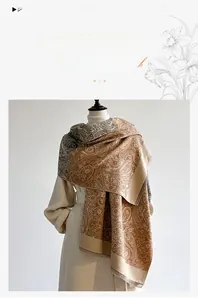 Detail of paisley pattern on warm cashmere-like scarf with thick autumn-winter texture