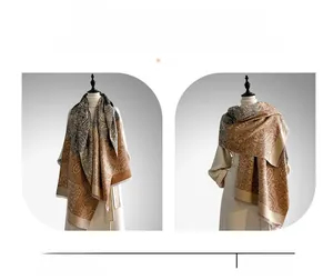 Close-up of retro paisley pattern scarf showing soft fabric texture and warm brown tones
