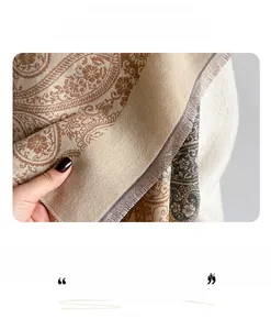 Detail of paisley pattern shawl showing soft texture and fine twisted fringe edges