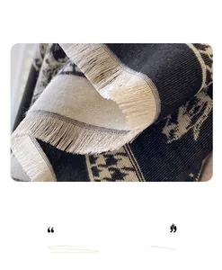 Close-up of thick floral cashmere-like scarf with fringed edges and houndstooth pattern