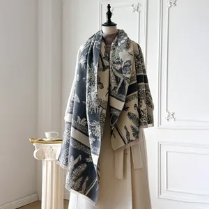 Detail of cashmere feel scarf featuring vintage forest animal prints and frayed edges