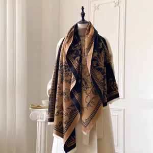 Close-up of floral print and houndstooth pattern on thick cashmere-like winter scarf