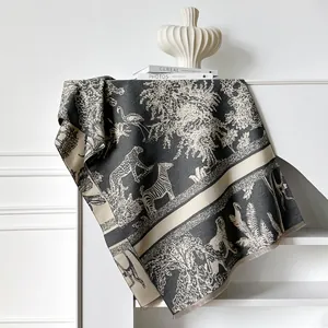 Artistic jungle animal print cashmere feel scarf with fringe on a minimalist shelf
