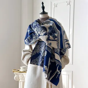 Detail view of the thick blue and white pastoral scenery pattern with fringe edges