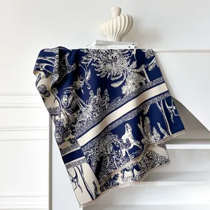 Close-up of navy and cream Toile de Jouy scarf with animal patterns and fringe edge