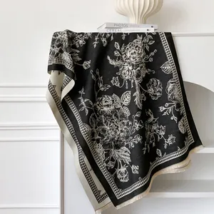Detail of the houndstooth border and floral pattern on the black and beige pashmina