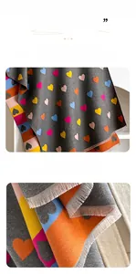 Close-up of colorful heart pattern on faux cashmere scarf with fine fringe trim detail
