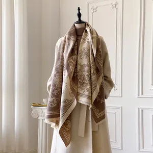 Detail of floral and houndstooth pattern on beige cashmere-feel thick winter scarf