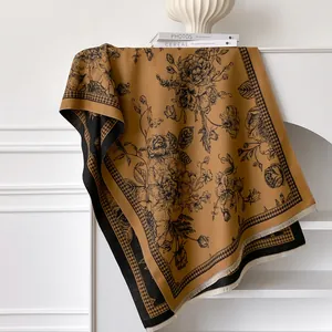 Thick cashmere-like scarf with mustard yellow floral print and houndstooth edge fringe