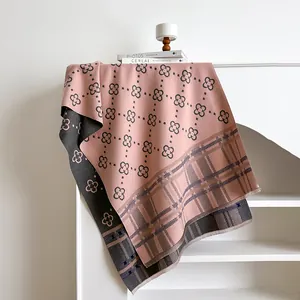 Soft cashmere-feel reversible shawl with clover print and fringe tassels in pink and grey