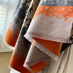 Winter faux cashmere scarf with orange and grey abstract print and fringe detail