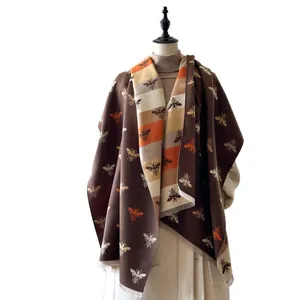 Elegant thick cashmere-like shawl with double-sided bee pattern and fringe trim