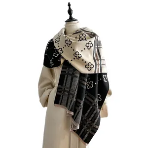 Checkered vintage floral cashmere shawl with fringe on off-white wool coat