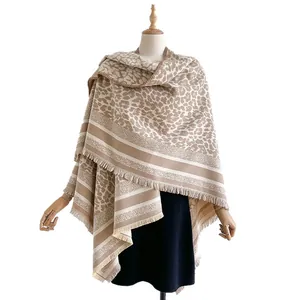 Thick leopard print cashmere scarf wrap for women with tassel trim in a beige coffee tone