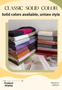 Detailed view of layered rib-knit winter scarves in multiple solid color options
