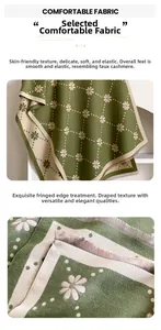 Détail d'une écharpe vert olive en imitation cachemire avec motif marguerites et franges