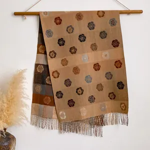 Detail of reversible cashmere scarf with vintage roses and classic plaid tassel pattern
