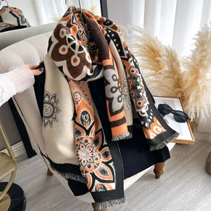 Detail of bohemian cashmere-feel shawl with vintage patterns and fringe edges