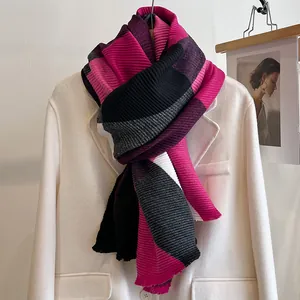 Close-up of winter scarf showing pleated texture and bold color block patterns