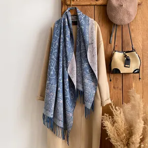 Detail of floral jacquard shawl scarf with fringes, showing rich texture and vintage pattern