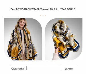 Close-up of thick floral cashmere shawl featuring fringe edges and mustard yellow floral print