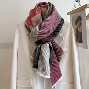 Detail of multi-color pleated scarf with wine red and grey geometric stitching texture