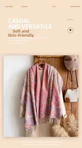 Pink paisley jacquard shawl with tassels over a khaki wool coat for winter styling