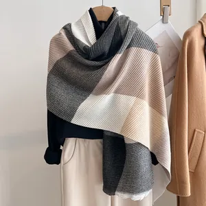 Detail of multi-color pleated scarf with vertical texture and minimalist color blocking