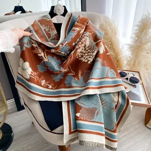 Detailed texture of thick vintage floral scarf with elegant fringe and orange accents