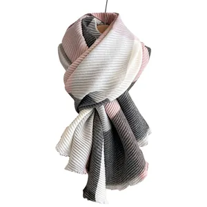Elegant pleated patchwork scarf in pink, white, and grey with soft fringe details